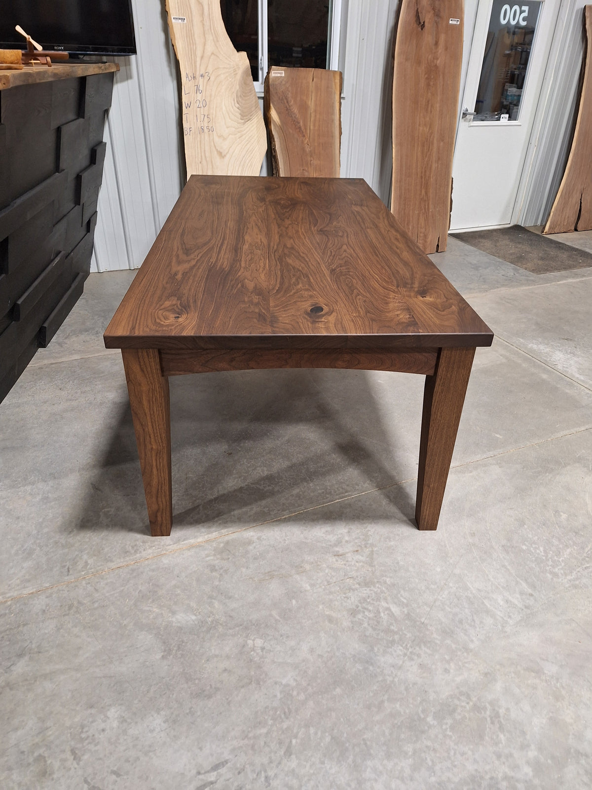 End view of the 42 x 96 inch solid walnut farmhouse dining table