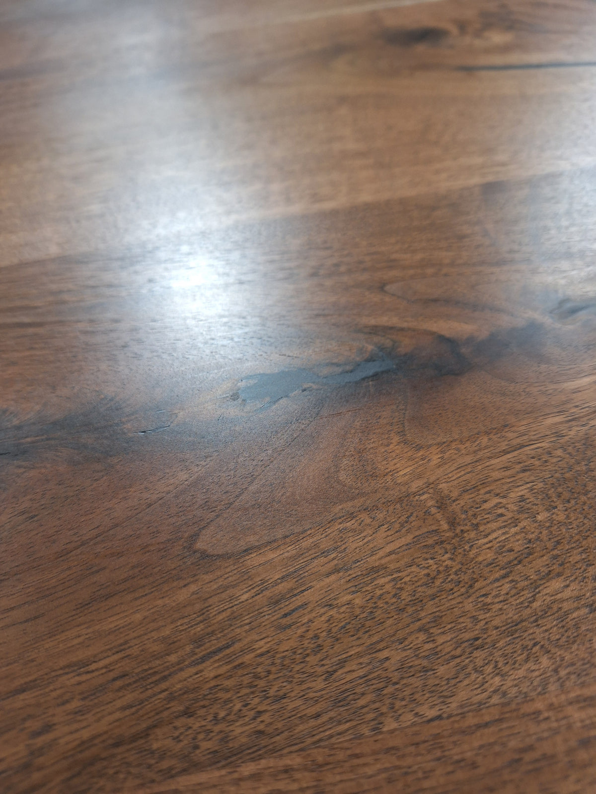 Close-up of solid walnut Face Grain on a desk top