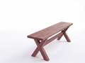 A rustic wooden bench with a dark brown finish and an X-shaped cross base, positioned on the right side of a clean white studio background.
