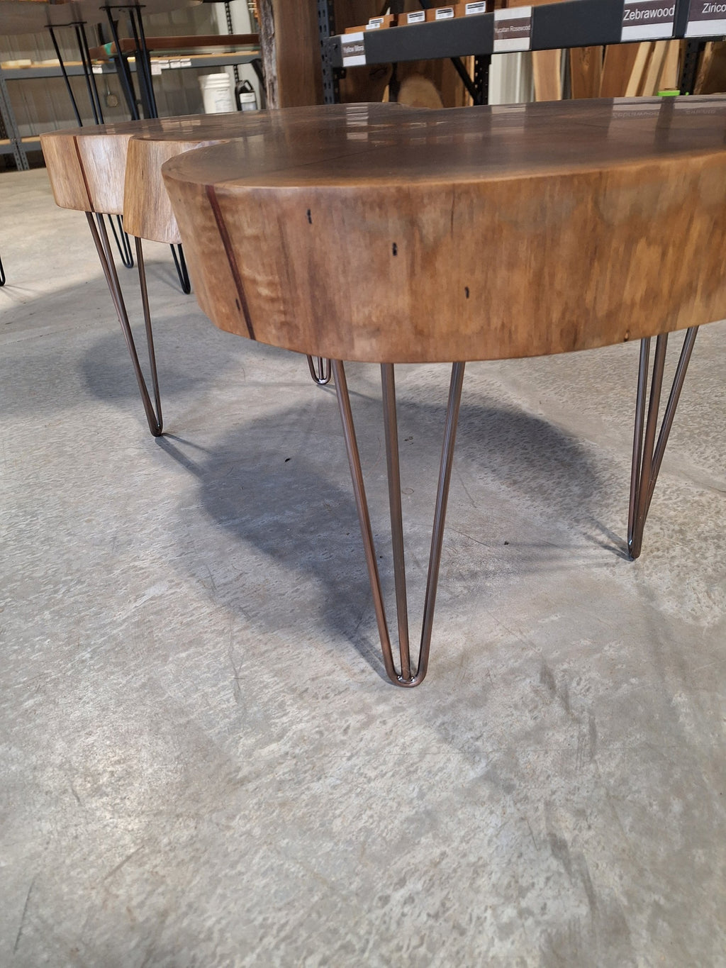 Solid walnut live edge cookie table with white epoxy inlay and black hairpin legs, photographed in our Hiawatha shop (photo 4)