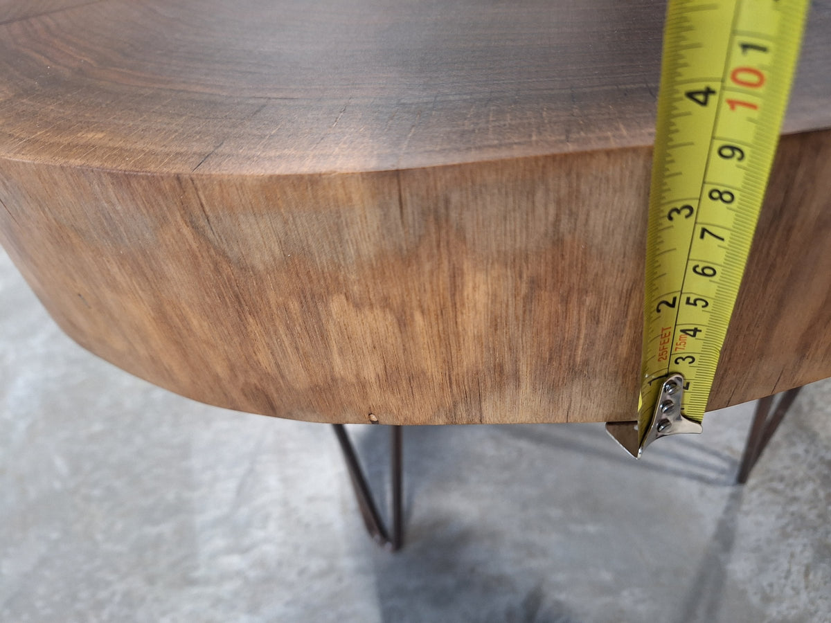 Solid walnut live edge cookie table with white epoxy inlay and black hairpin legs, photographed in our Hiawatha shop (photo 5)