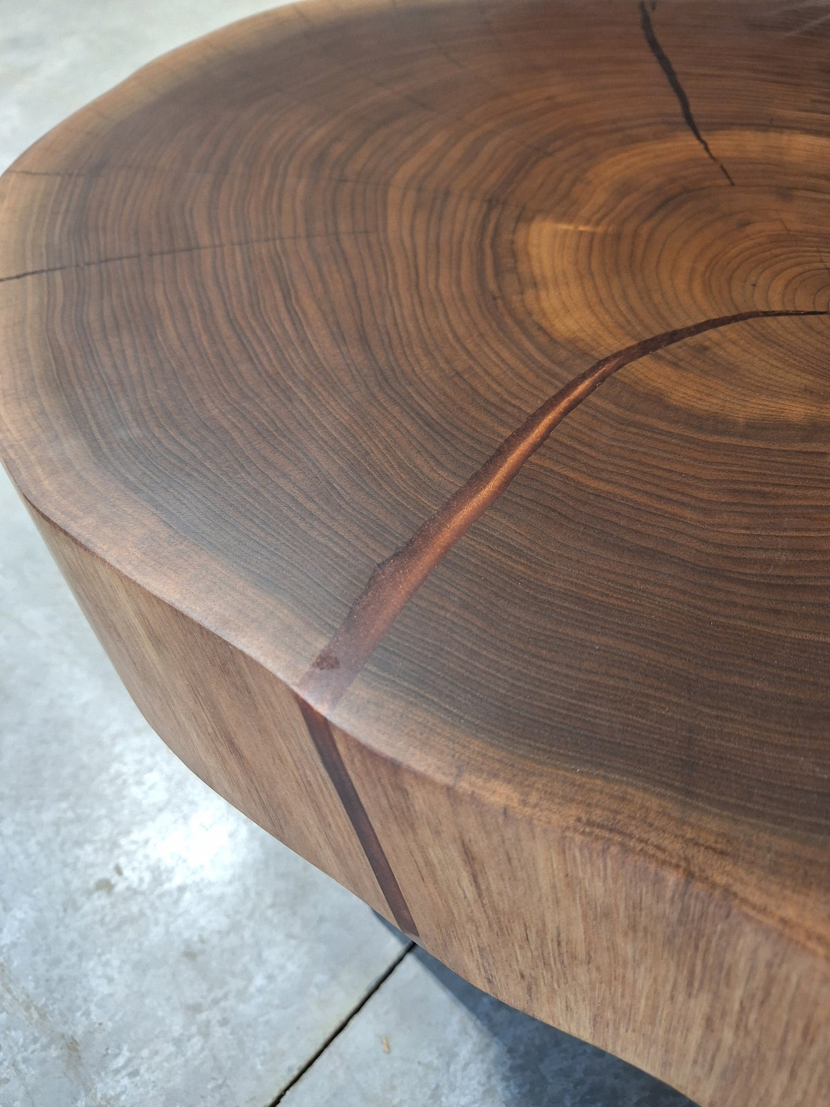 Solid walnut double cookie coffee table with copper resin and copper hairpin legs, photographed in our Hiawatha shop (photo 4)