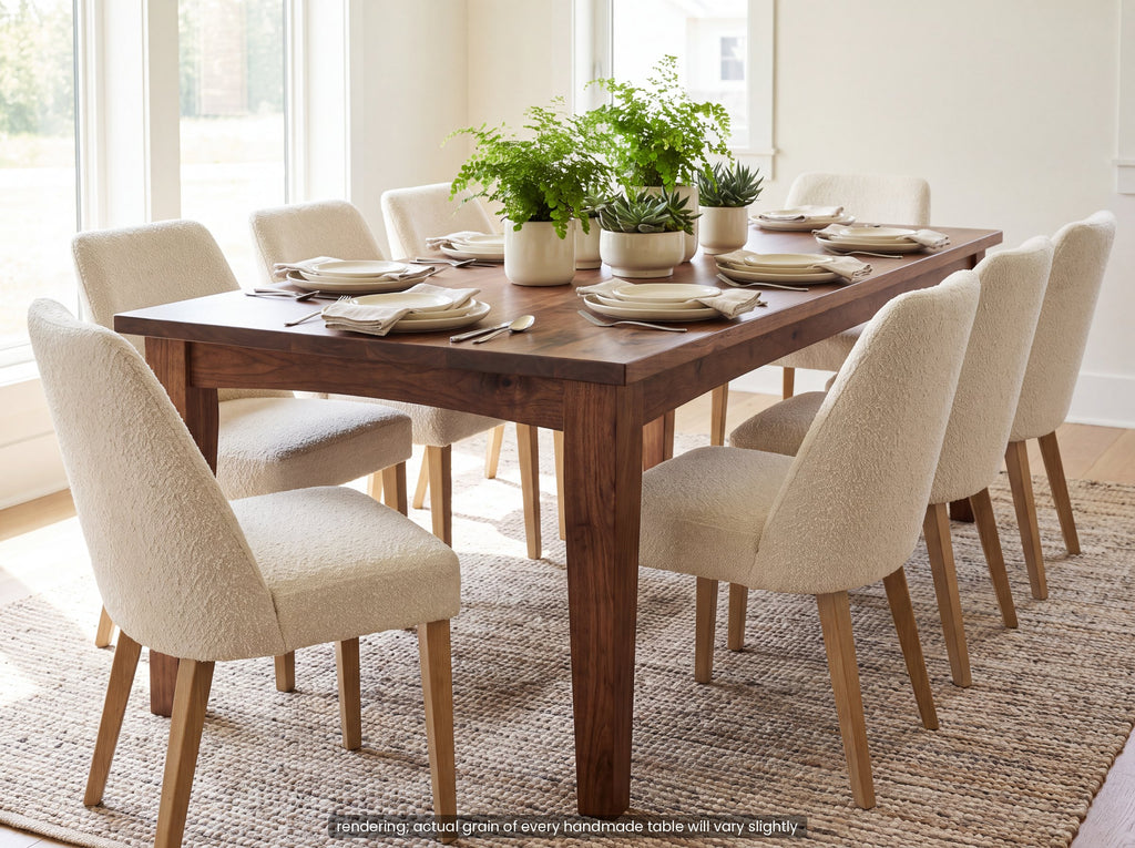 Solid walnut farmhouse dining table with cream chairs in a bright dining room (rendering).